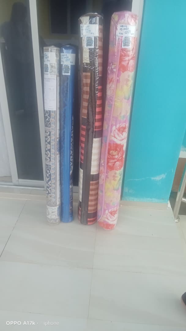 Karpet pelanggan yang telah siap dicuci, digulung dan dibalut